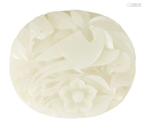 A Chinese pale celadon hardstone oval plaque, late Qing dynasty, carved with a phoenix amid