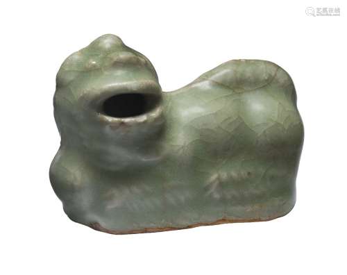 A Chinese Longquan celadon waterdropper, Ming dynasty, modelled as a recumbent Buddhist lion, 7cm