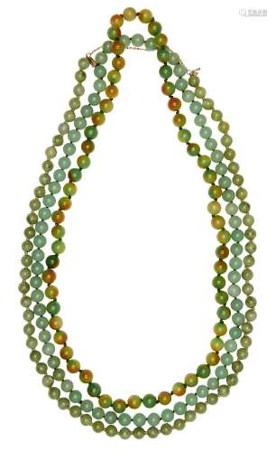 Three jade/jadeite bead necklaces, 20th century, all in tones of green, one with variegated green/