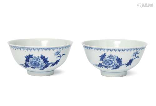 A pair of Chinese porcelain ogee bowls, 19th century, painted to the exterior with floral sprays,