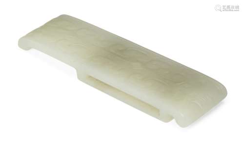 A Chinese white jade archaistic belt mount, 18th/19th century, carved to the upper surface in low