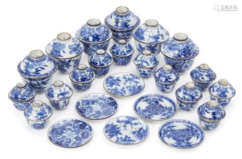 A collection of Chinese miniature tea bowls, covers, and saucers, 20th century, each painted in