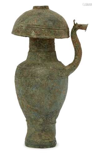 A Vietnamese bronze ewer, Dong Son culture, 6th-4th century BCE, the domed rim engraved with bands
