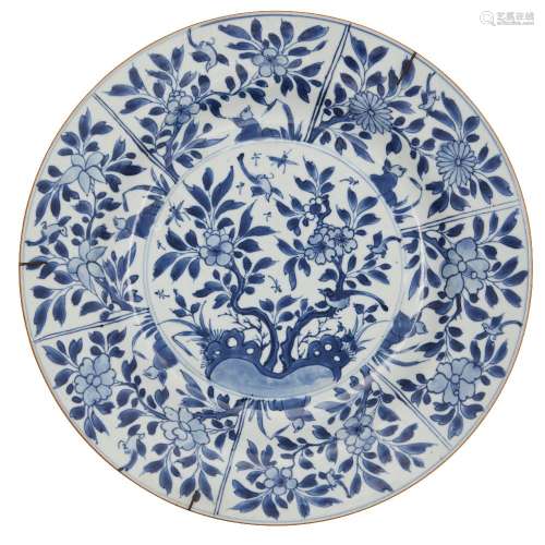 A Chinese export porcelain charger, 18th century, painted in underglaze blue with birds amid