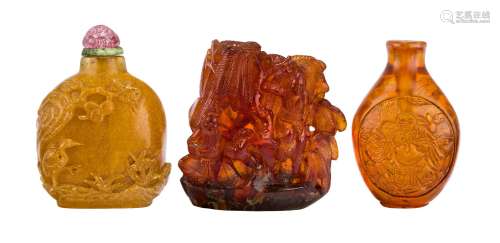 Two Chinese amber snuff bottles and an amber carving, late 19th- early 20th century, the carving