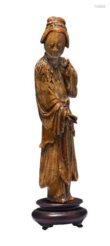 A Chinese ivory figure, Ming dynasty, carved as a standing woman wearing flowing robes, 14.5cm high,