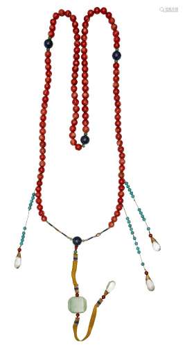 A Chinese Mandarin court necklace, c.1900, composed of 104 coral beads, lapis and jadeite spacers,