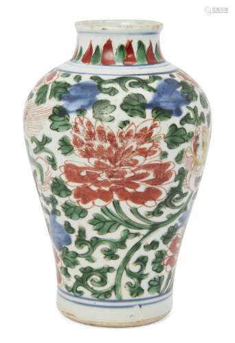 A Chinese porcelain wucai baluster vase, Ming dynasty, 17th century, painted with two Buddhist lions