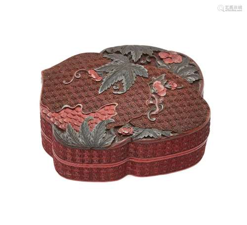 A Chinese two-colour cinnabar lacquer box, 18th century, carved to the cover with two