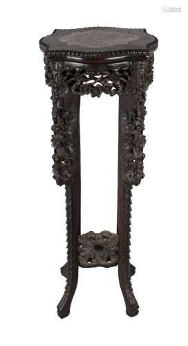 A Chinese hardwood and rouge marble inset jardinière stand, 19th century, profusely carved