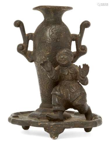 A Chinese bronze incense holder, mid-19th century, modelled as a boy standing beside a twin-