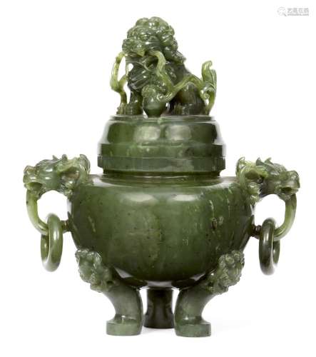 A Chinese spinach jade tripod censer, 19th century, the cover surmounted with carved Buddhist lion