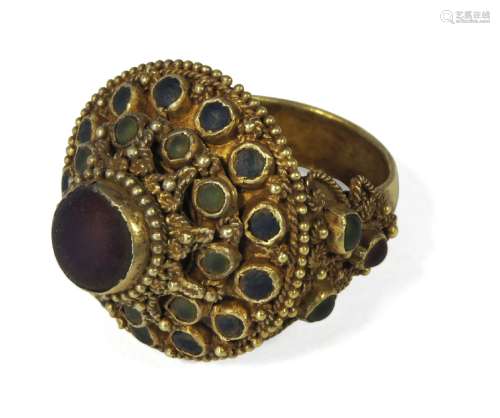 A Thai gold target ring, late 19th century, set with paste stones in filigree mountPlease refer to