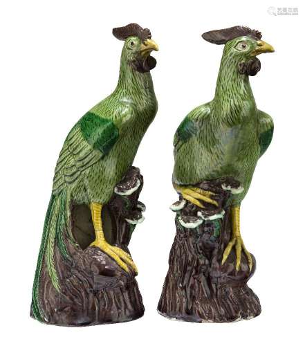 A pair of Chinese porcelain jungle fowl, mid-19th century, each perched on a tree stump issuing