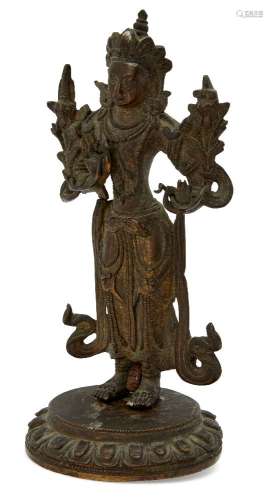 A Tibetan bronze figure of Manjushri, early 20th century, the left hand holding a flowering lotus