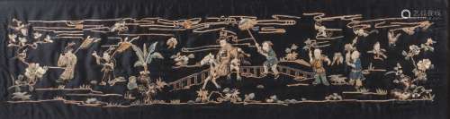 A Chinese silk embroidered landscape panel, early 20th century, decorated with a rider on