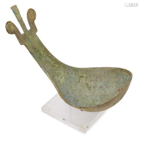 A Chinese bronze ritual ladle, Shang dynasty, mid-Anyang period, with broad bowl and flat handle