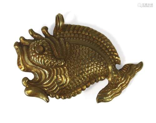 A large Thai gold pendant, 19th century, modelled as a fish, with paste set eyes, 7cm x 5cmPlease