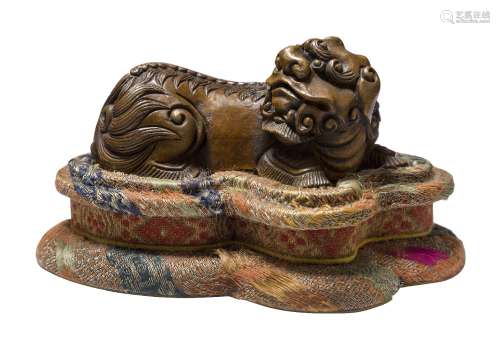 A Chinese bronze scroll weight, 18th/19th century, finely cast as a recumbent Buddhist lion, 7cm