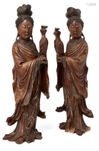 A pair of Chinese carved hardwood figures of Guanyin, early 20th century, modelled standing