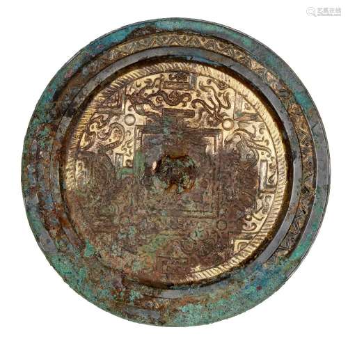 A Chinese parcel-gilt bronze 'TLV' mirror, Western Han dynasty, 2nd-1st century BC, the central knob