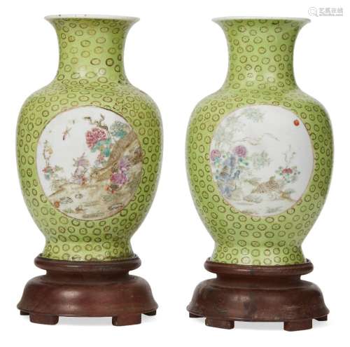 A pair of Chinese porcelain vases, Tongzhi period, painted in famille rose enamels to two circular