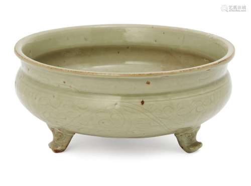 A Chinese Longquan celadon tripod censer, Ming dynasty, the everted rim above band of incised