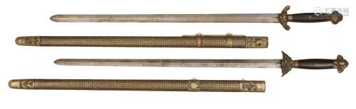 Two similar Chinese ceremonial swords (jian), 19th century, each with wooden handles, brass pommel
