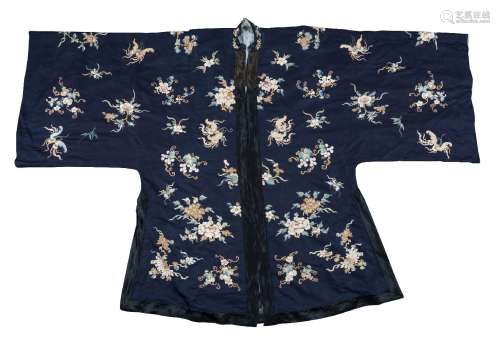 A Chinese silk blue ground robe, late Qing dynasty, embroidered throughout with butterflies amid