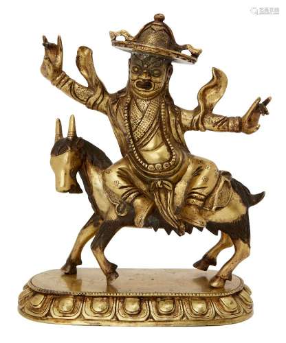 A Chinese gilt bronze figure of Sridevi on horseback, late 19th/early 20th century, Sridevi with