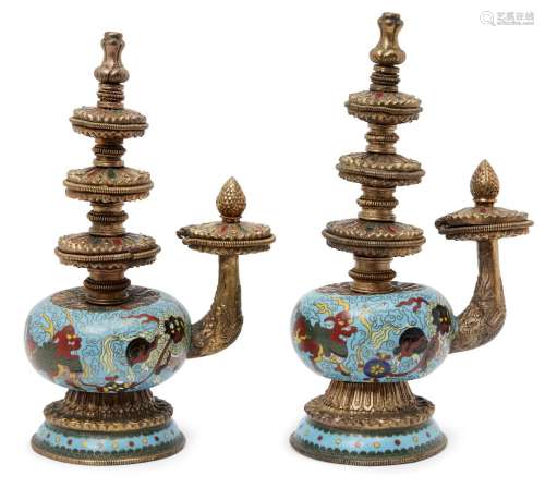 A pair of Chinese Tibetan-style cloisonné ewers, the globular bodies decorated with Buddhist