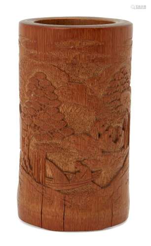 A Chinese bamboo brush pot, early 20th century, carved with three scholars and a boatman in a wooded