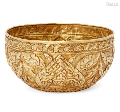 A Thai gold ceremonial repousse bowl, late 19th century, decorated to the sides with stylised