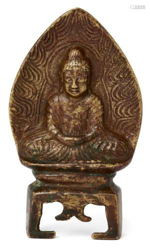 A Chinese bronze votive figure of Buddha, Northern Wei dynasty, depicting Shakyamuni Buddha with