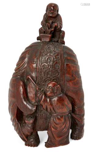A Chinese bamboo elephant carving, late 19th century, the elephant standing beside a trainer and