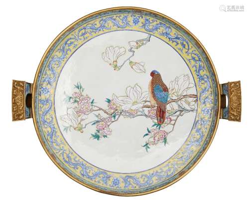 A large Chinese gilt metal and enamel twin handled dish, late 19th century, painted to the central