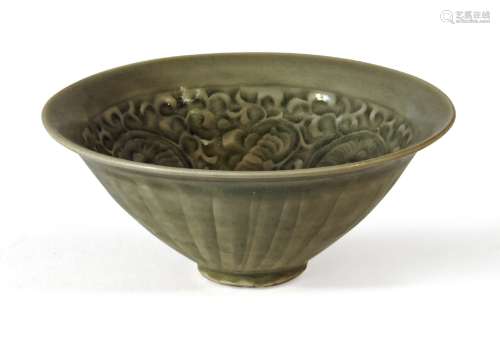 A Chinese Yaozhou celadon glazed conical bowl, carved to the inside with meandering flowering