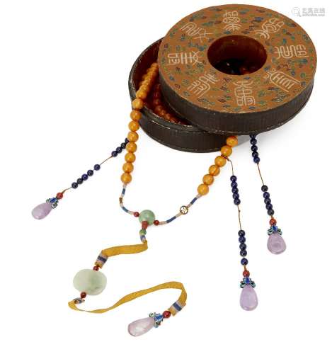 A Chinese Mandarin court necklace, c.1900, comprising 108 amberoid beads, jadeite spacers, and lapis