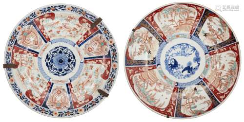 A near pair of large Japanese porcelain imari chargers, late 19th century, each painted with