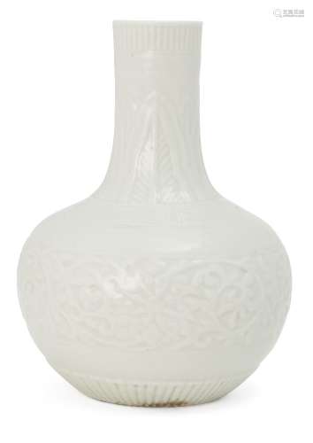 A Chinese Dehua porcelain small vase, tianqiuping, late Qing dynasty, moulded with vertical stiff