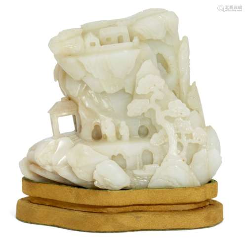A Chinese white jade 'mountain' carving, 20th century, carved to one side with two scholars