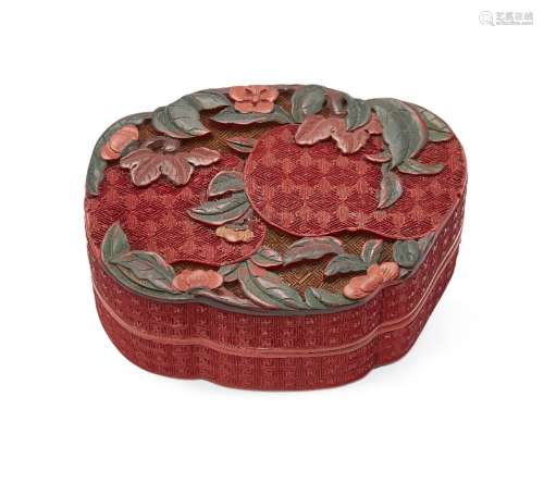A Chinese two-colour cinnabar lacquer box, 18th century, the cover carved with a fruting branch, the