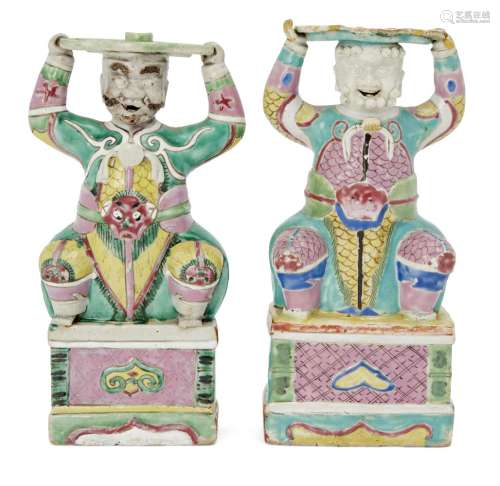A pair of Chinese famille rose porcelain candle holders, Qianlong period, modelled as crouching