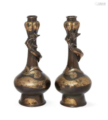 A pair of Chinese bronze parcel-gilt garlic-head bottle vases, 16th-17th century, each applied