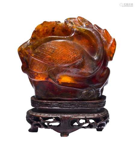 A Chinese amber vase, early 19th century, carved with a crane beneath a pine tree, on carved and