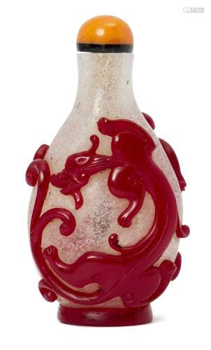 A Chinese glass overlay snuff bottle, 19th century, decorated in red over clear glass with two chi-
