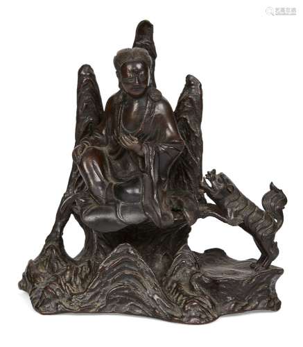 A Chinese bronze 'Guanyin' censer, Ming dynasty, modelled as Guanyin seated in front of three
