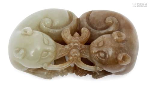 A Chinese celadon jade carving of two cats, early 19th century, each cat seated, clasping a