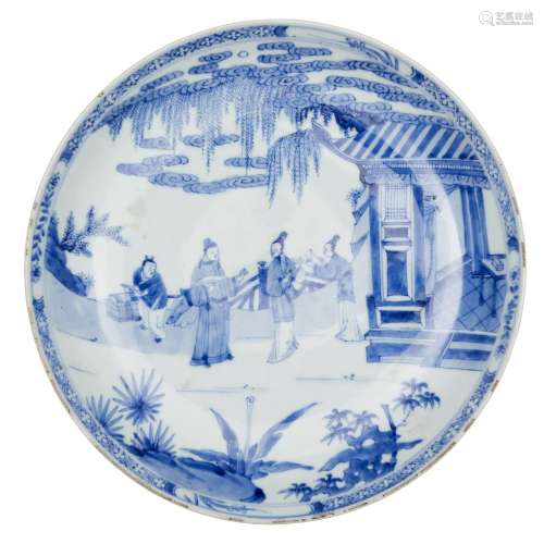 A large Chinese porcelain dish, Yongzheng mark and period, painted in underglaze blue with a scene
