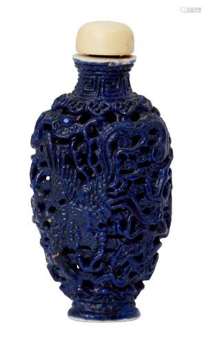 A Chinese porcelain reticulated monochrome snuff bottle, early 20th century, decorated with a dragon